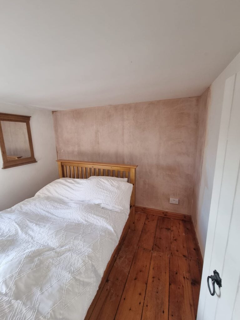 Soundproofed bedroom wall fully plastered